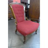 A Victorian walnut and upholstered lady's chair