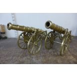 A pair of brass model cannons