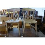 A pair of Victorian elm and beech kitchen chairs