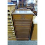 An Edward VII mahogany tambour front filing cabinet (locked -without key)