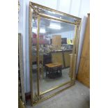 A large French style gilt framed mirror, 195 x 137cms
