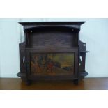 An Arts and Crafts oak wall hanging cabinet, to Shapland & Petter, Barnstaple