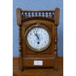 A Victorian Aesthetic Movement oak mantel clock
