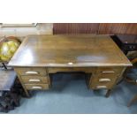 An oak pedestal desk