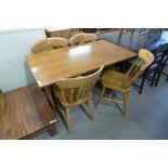 An oak refectory table and four chairs