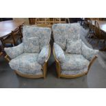 A pair of Ercol Blonde Renaissance armchairs