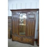 A Victorian walnut and burr walnut combination wardrobe