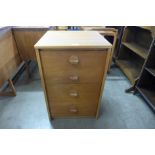 A small teak chest of drawers