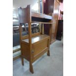 A small Arts and Crafts oak bookcase