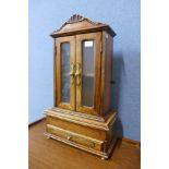 A miniature French fruitwood armoire, 63cms h