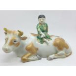 A Meiji period Arita porcelain boy and buffalo, buffalo a/f (horn missing)