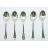 A set of five silver teaspoons, golfing interest, hallmarked Walker & Hall, Sheffield 1933, 68.2g