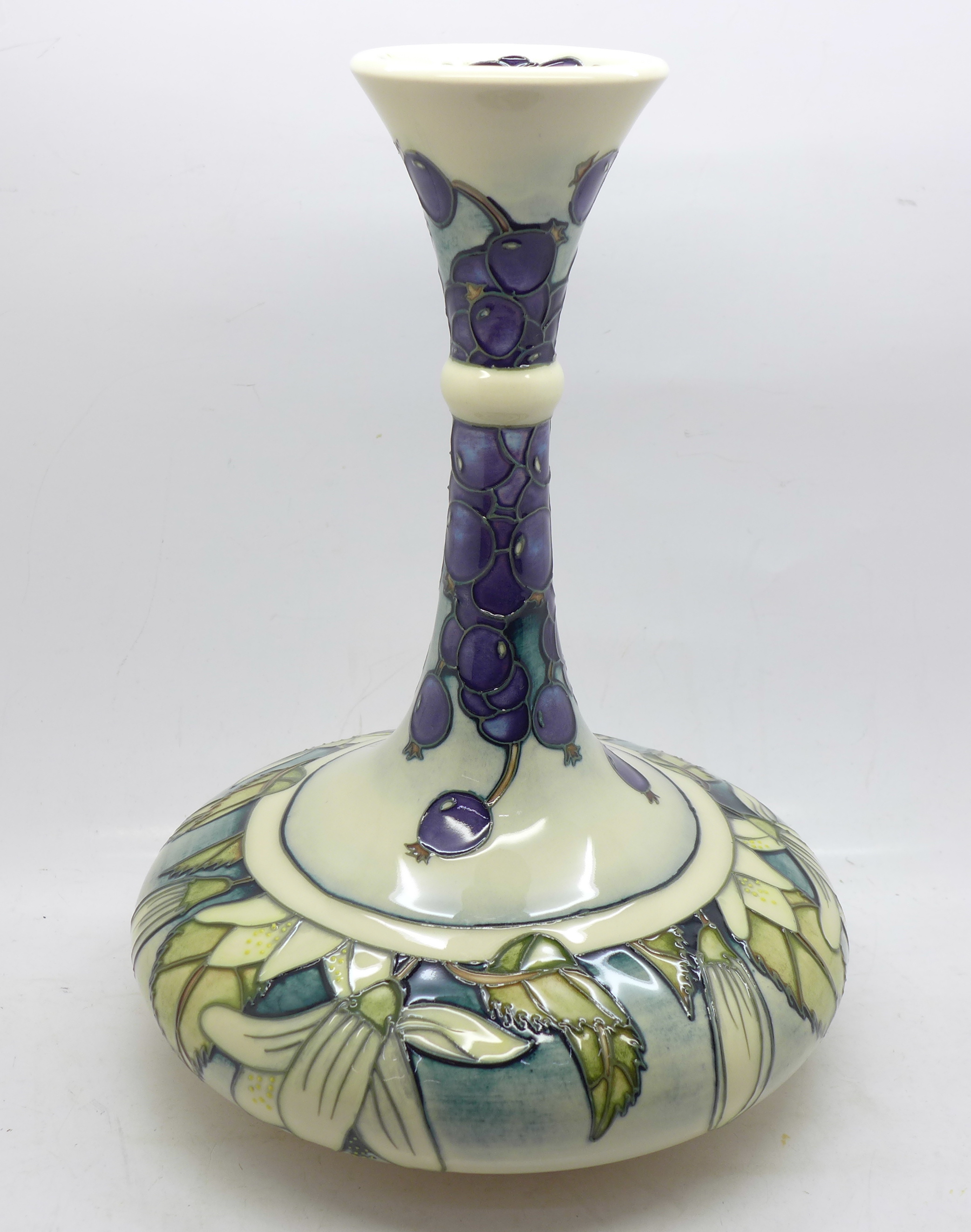 A Moorcroft Juneberry vase, designed by Angela Davenport, signed on the base, 24cm, boxed