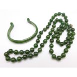 A nephrite jade necklace and a bangle