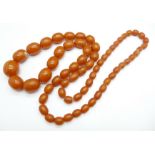 An amber coloured bead necklace