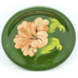 A Moorcroft Hibiscus pattern dish, 18.5cm