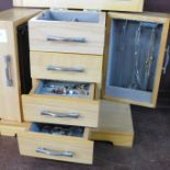 A collection of costume jewellery in a jewellery cabinet