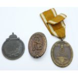 Two German medals and a reproduction German badge