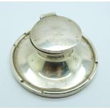 A silver Capstan inkwell