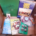 A horse racing winner's blanket with rosettes, Newmarket enamel badges, a Benson and Hedges Book