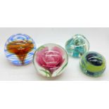 Four glass paperweights including Caithness Inner Circle