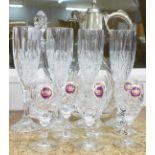 A claret jug and a glass decanter with six Webb Continental glasses and four champagne glasses