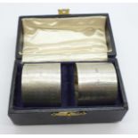 A pair of silver napkin rings, boxed, 58g