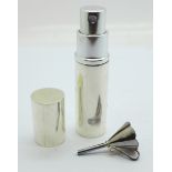 A silver perfume atomiser with funnel