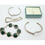 A collection of silver jewellery including two bangles, a Rennie Macintosh style bracelet, another