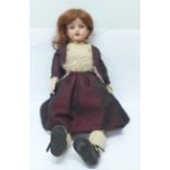 An Armand Marseille doll, 390 backstamp, with later clothing