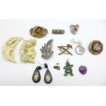 Two micro-mosaic brooches, two carved brooches, one lacking pin, a citrine set brooch lacking pin,