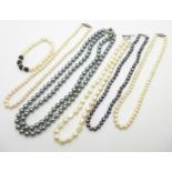 Four pearl necklaces including one freshwater with silver fastener, a freshwater pearl bracelet