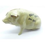 An early Denby stoneware piggy bank, 16cm, designed by Horace Elliott, marked Olive Weston, Dec