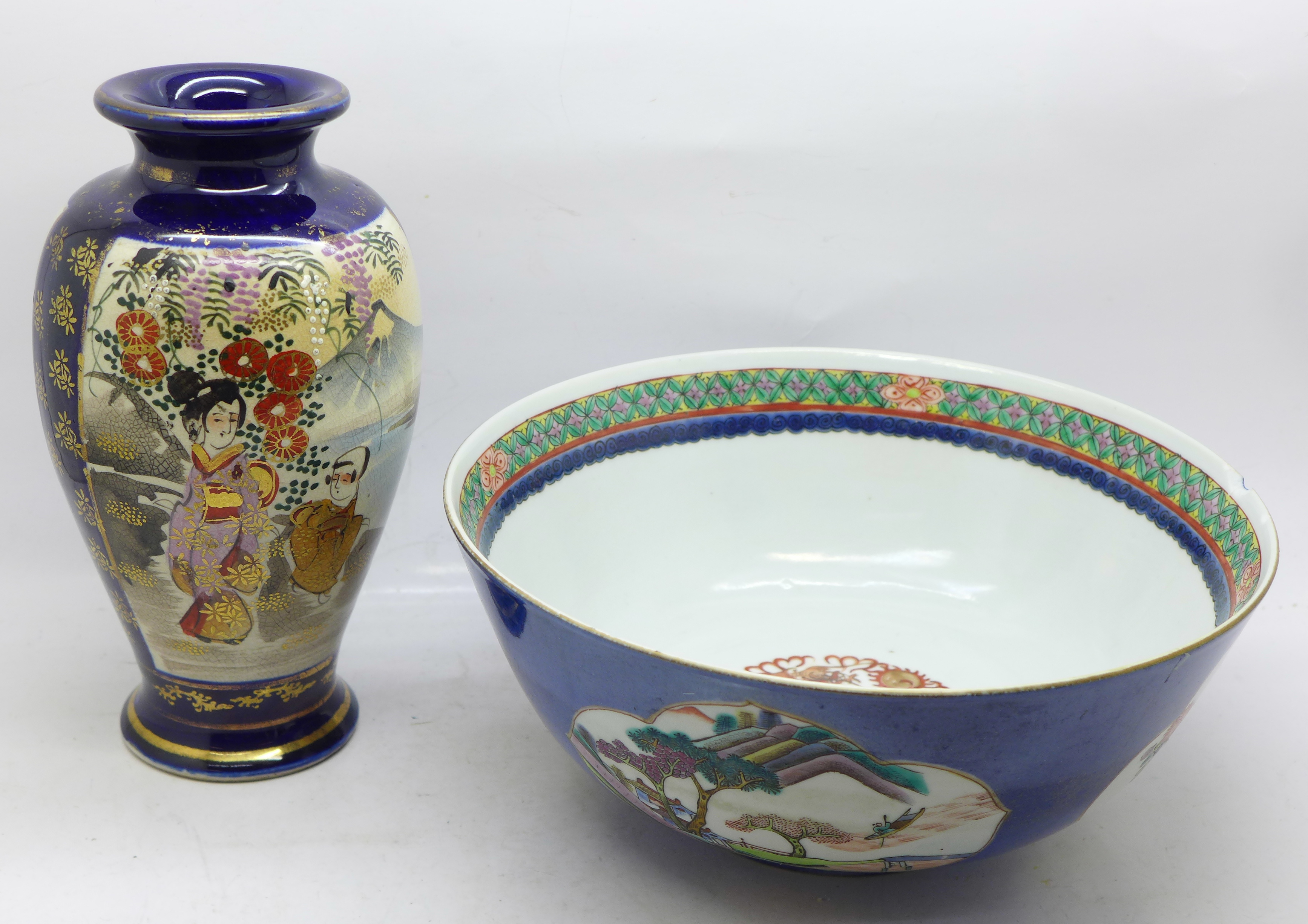 A Chinese blue ground famille rose hand painted porcelain bowl with panels of figures, flowers and