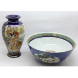 A Chinese blue ground famille rose hand painted porcelain bowl with panels of figures, flowers and