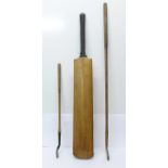 A cricket bat (Gunn and Moore) and two child's golf clubs