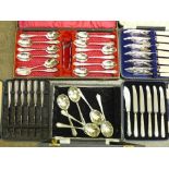 Two cases of six silver handled knives (6+5), a silver handled butter knife and three other cases of