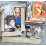 An Armand Marseille 390 doll, a/f, children's annuals, a puppet and a box of History of WWII