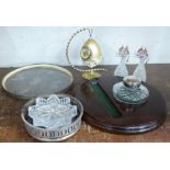 An inkwell and pen stand, a plated and glass tray, a wine coaster, an ashtray and an egg shaped