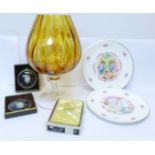 A large amber brandy glass shaped vase, two Peter Bates miniature cameos, boxed, a Holy Bible with