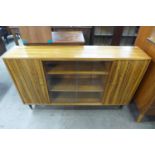 A teak and afromosia bookcase
