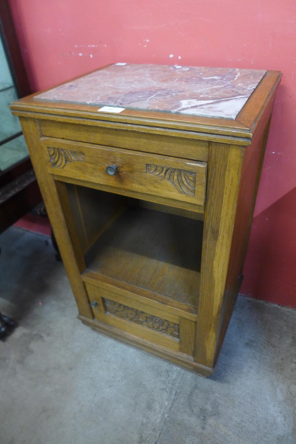 A French Art Deco oak and marble topped table de nuit