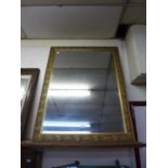 A large gilt framed mirror