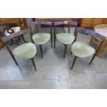 A set of four Danish Frem Rojle teak chairs