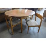 A teak dining table and four chairs