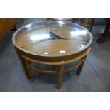 A Nathan teak and glass topped circular nest of tables