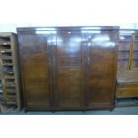 An early 20th Century mahogany three door Compactum wardrobe