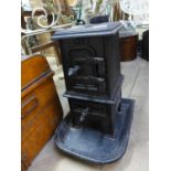 A small cast iron log burning stove