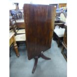 A George III mahogany rectangular tilt top tripod table