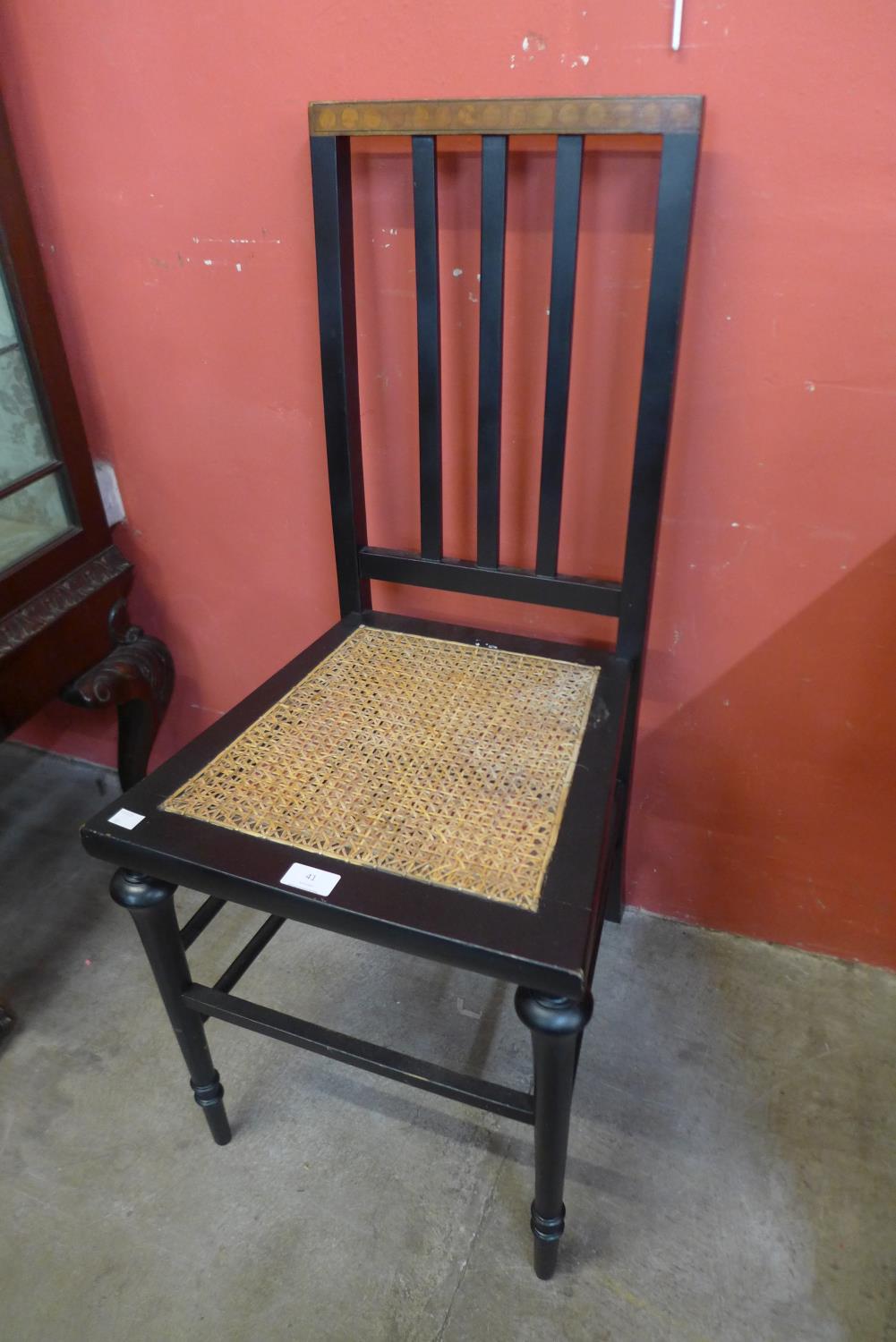 An Art Deco ebonised and rush seated bedroom chair